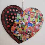 Recycled Art - a heart, decorated with bits of cut up tin, multi coloured