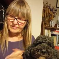 photo of Artist Nicola Griffin, with her dog rudi.